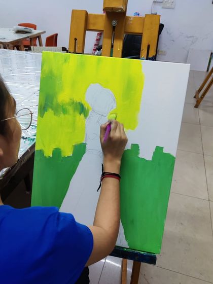 The creation of a colorful, abstract silhouette painting, showing the process of layering bright acrylics to create a stunning final piece.