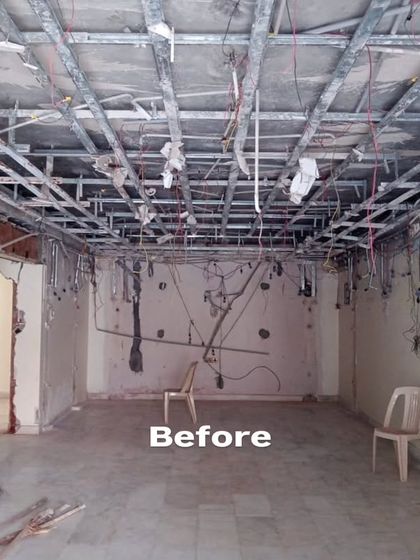 The 'Before' shot of the multi-purpose living room, showing exposed ceiling framework and bare walls. This raw space was a blank slate for us to create a completely new environment tailored to the client's hobbies and lifestyle.