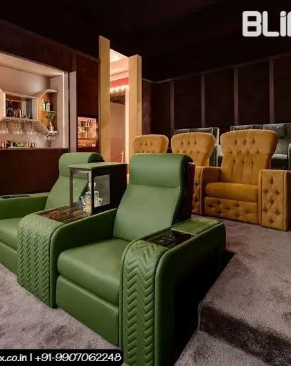 This home theater combines entertainment with luxury hospitality, featuring a built in bar at the back. We used a bold color scheme with custom green and yellow upholstered recliners to create a unique and vibrant space for hosting and viewing.