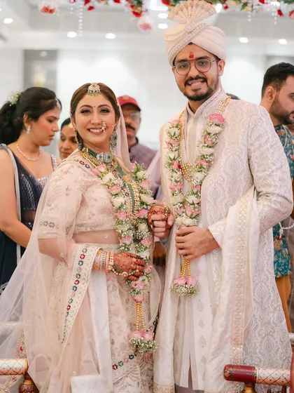A beautiful portrait of the happy couple during their wedding ceremony. The bride's makeup is flawless, and her joy is absolutely radiant.