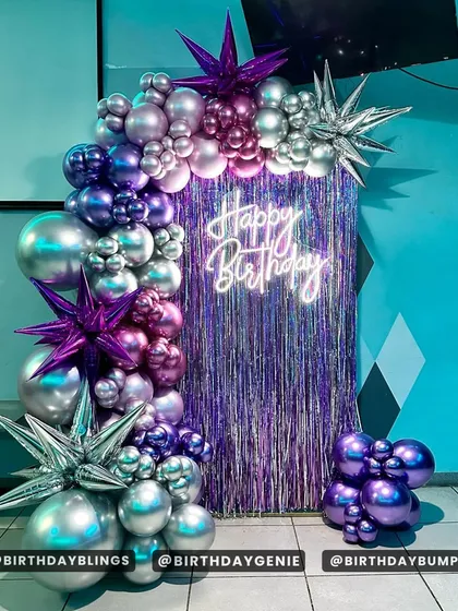 A full view of the purple fringe backdrop setup, perfect for a dance party or a teen's birthday.