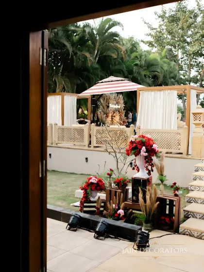 A peek into the event space from a doorway. This view shows how I layer different decor elements, from the floral arrangements in the foreground to the lounge areas in the back.
