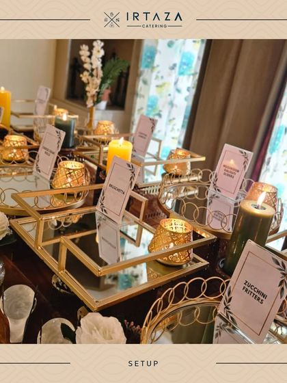 Mirrored trays and tiered stands are a great way to add dimension and reflect the beautiful candlelight, making the appetizer station look even more impressive.