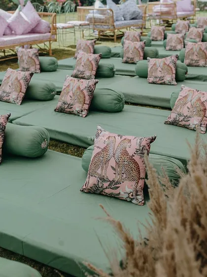 A closer look at the jungle-themed floor seating. The green mattresses are adorned with pink leopard-print cushions, blending a touch of wildness with soft, comfortable design.