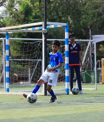 A player prepares to take a shot on goal during a match against CS Vikingos.