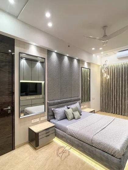 A full view of the grey bedroom, showcasing the interplay of rich textures and a serene color palette. The design creates a sophisticated sanctuary for ultimate comfort.
