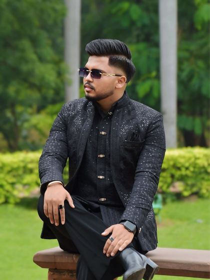 The black Indo-Western suit styled with sunglasses for a cool, contemporary vibe. This shows how my traditional outfits can be adapted for a modern man's wardrobe.