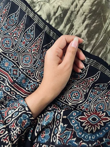 A close-up of the beautiful Ajrakh hand-block print, showing the fine details and rich colors of this traditional art form.