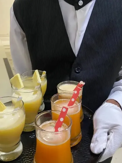 Hospitality is key to our service. Our professionally dressed staff ensures your guests feel welcomed from the moment they arrive, serving refreshing welcome drinks like this Guava Pineapple Blossom and Orange Mint mocktail.