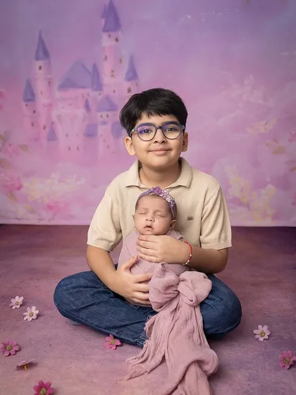 A beautiful portrait of the two siblings, capturing a moment of quiet connection.