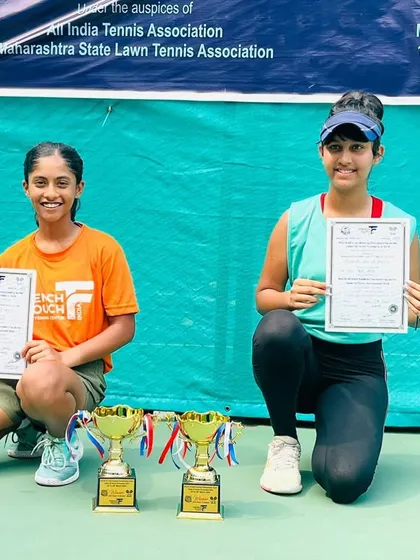 Showcasing the results of our doubles strategy training. Eshal Pathan and her partner pose with their winner's trophies and certificates after securing the Doubles title at the U16 AITA event.