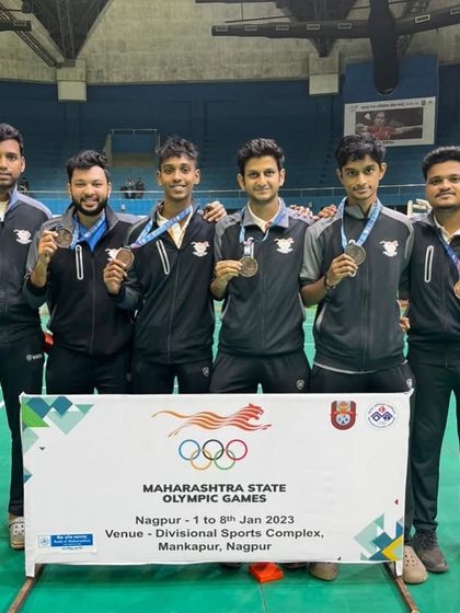 A closer look at the men's team with their bronze medals. Teamwork is a value we cherish and teach, and our coaches exemplify it.