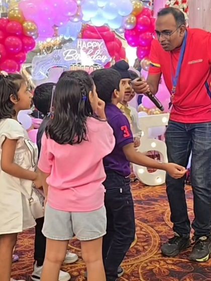 Our coach engaging with the kids in a banquet hall setting. We are experts at managing groups and keeping the energy high, no matter the location.