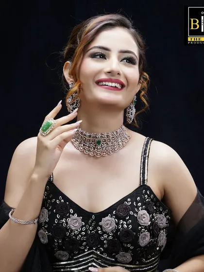 This is a classic commercial look I created for a jewelry brand campaign. The hairstyle is a soft, elegant updo with face-framing tendrils, designed to look polished and sophisticated while highlighting the diamond and emerald jewelry.