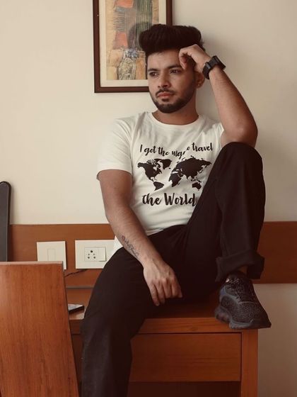 A thoughtful, seated pose from an indoor lifestyle shoot. This image has a relaxed and natural feel, perfect for personal branding content.