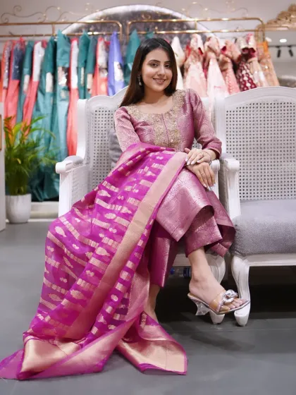 An outfit that exudes class, celebrates culture, and radiates charm. This pink Banarasi suit is simply beautiful.