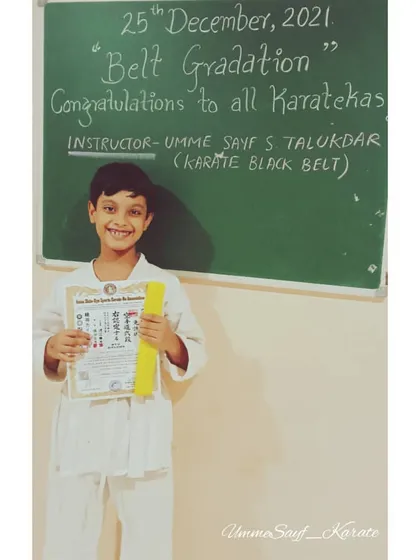 Happiness is a new karate belt. This young student is all smiles after receiving his yellow belt and certificate. 💛