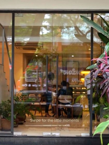 A swipeable post showing the little moments that make our cafe special, starting with a view through our front door.