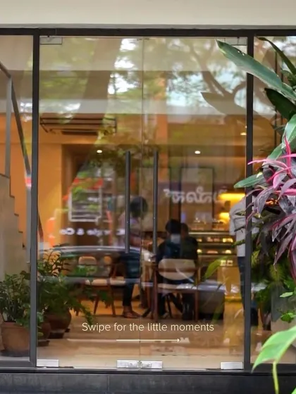 A swipeable post showing the little moments that make our cafe special, starting with a view through our front door.