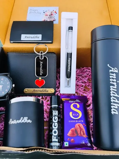 Another look at a fully loaded black-themed gift box. This one includes a temperature bottle, mug, wallet, watch, pen, card holder, keychain, and perfume, all personalized for a complete and impressive gift.