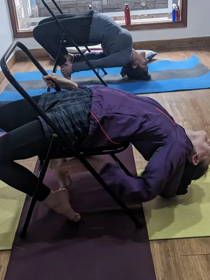 Post-Holi celebrations in the studio. We always find ways to have fun and connect, even while doing challenging backbends on the chair.