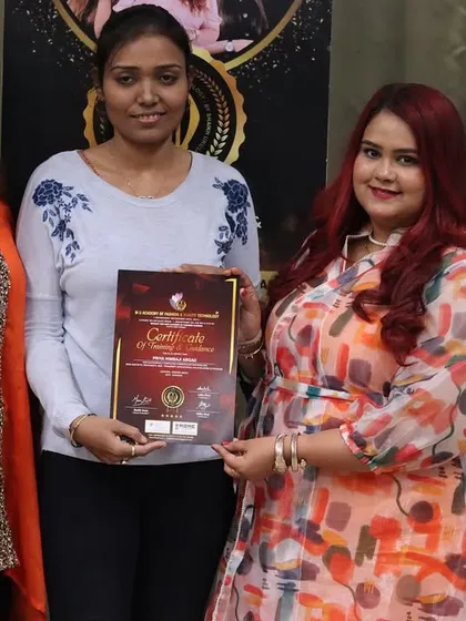 Presenting a certificate to a deserving student. My academy is a 5-star rated institution on Google, and I am committed to providing the best training and support to every person who walks through my doors.