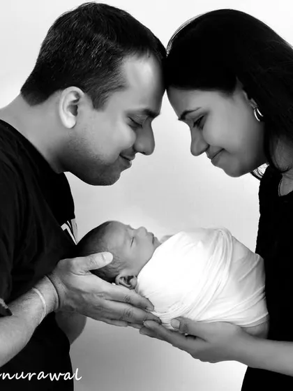 This is what it's all about: the quiet, powerful connection as you hold your new world in your hands. I focus on capturing these unscripted, emotional moments between parents and their baby, creating timeless black and white portraits that you will treasure forever.