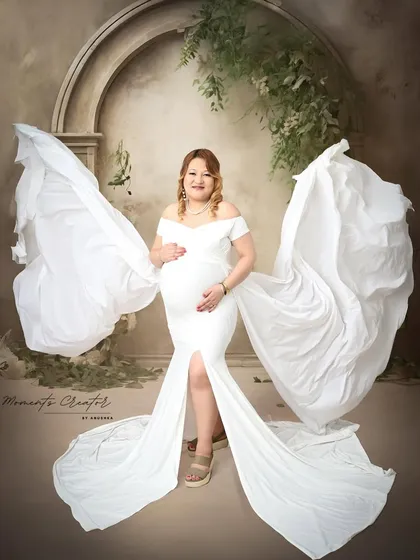 A truly angelic moment. I use flowing fabrics and dramatic poses to create ethereal solo portraits that celebrate the power and beauty of the expecting mother.