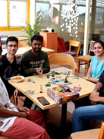 A game of 'King of Tokyo' on our sunlit terrace. The bright, airy space is perfect for a weekend afternoon of monster-battling fun.