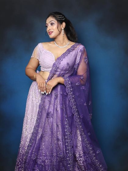 Lilac is the colour of the season! This look features a beautiful lilac and purple lehenga with matching eye makeup.