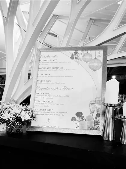 A black and white perspective of our bar design, highlighting the clean lines and elegant composition. The custom menu stands as a piece of art amidst the thoughtful decor.