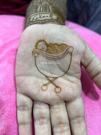 An even more minimalist version, showing just the outline of a baby in a cradle. This is perfect for someone who wants a very subtle and meaningful design.