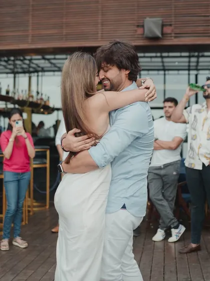 An emotional embrace right after the proposal. This candid shot is filled with the raw emotion and relief of the moment, a memory they will cherish forever.
