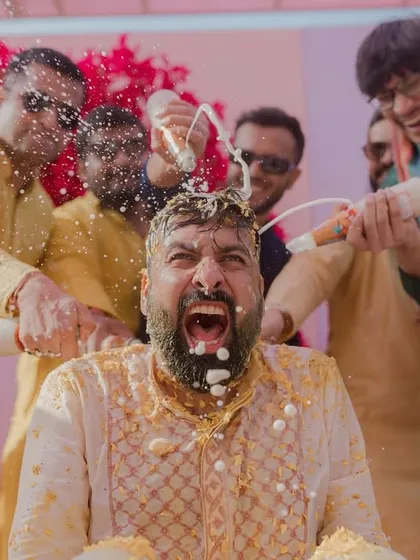 No holding back at this Haldi. The groom's friends and family go all out with beer and flowers, resulting in a hilarious and memorable moment.
