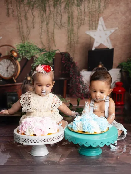 The twins curiously inspecting their individual cakes. It's so much fun to see how different their reactions can be.