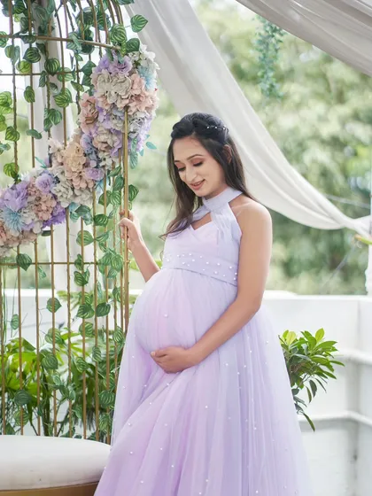 Our Breezy gown in a beautiful two-tone lavender and pink. The halter-neck design and pearl details make this a unique and eye-catching dress.