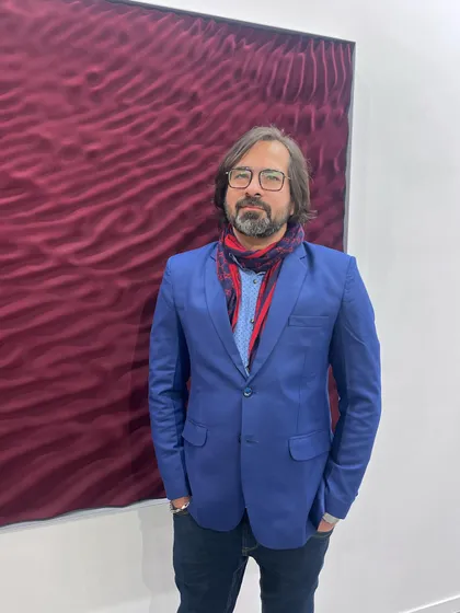 A photo of me at an art fair. These events are a great way to meet collectors and other artists and see what is happening in the contemporary art world.