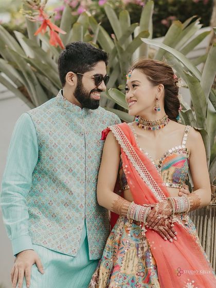 A lovely portrait of the couple during their Mehendi ceremony, sharing a look of love amidst the celebrations.