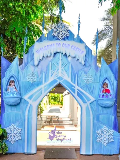 Guests were welcomed to Arendelle through this magnificent ice castle entrance. We designed this custom structure for a Frozen-themed party to create an immersive experience from the very first moment, complete with snowflake details and character cutouts.
