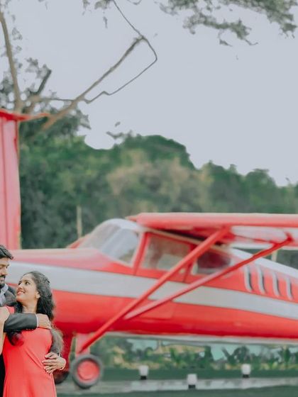 An intimate embrace in front of the airplane, showing its versatility for romantic shots.