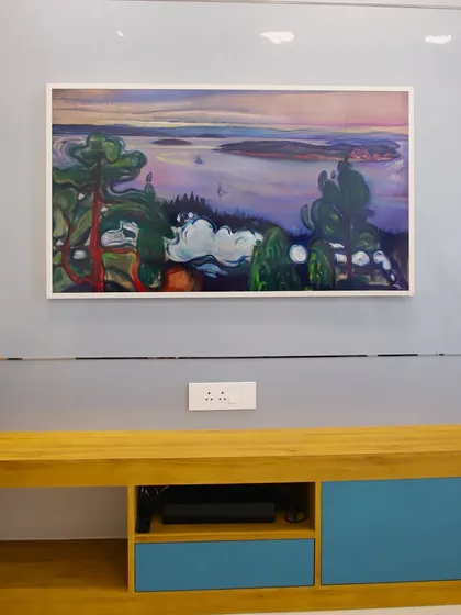 This TV doubles as a piece of art, framed to look like a painting when not in use. It's a perfect example of integrating technology seamlessly into the decor.