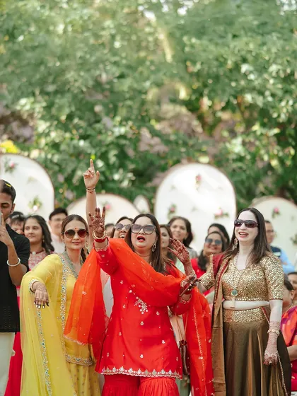 The bride's side bringing their own energy to the dance floor. It's this friendly competition and shared joy that makes Indian weddings so special.