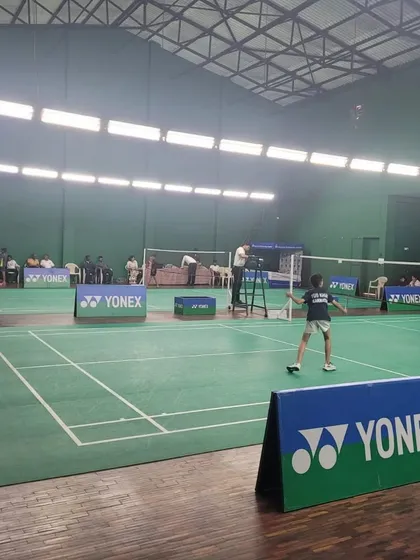 A full-court view of a singles match during the Yonex Sunrise championship hosted by us.