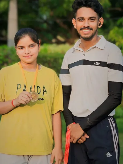 A dedicated student with her medal. Her progress in both skill and confidence has been incredible to watch.