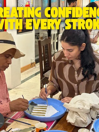 I help my students build confidence with every brushstroke. This image shows the supportive and collaborative atmosphere of my adult art classes.