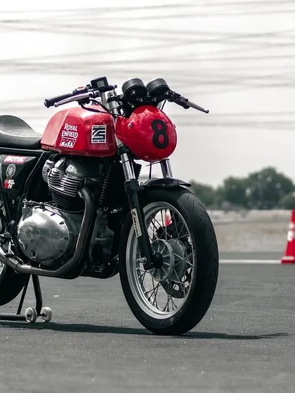 A Royal Enfield GT 650 on a paddock stand on the track.