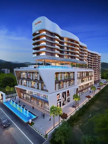 This is our design for the Tropicano project in Guwahati. We used a dynamic, curved facade to create a landmark building that seamlessly blends high-end residential living with commercial spaces, redefining urban elegance in the city.