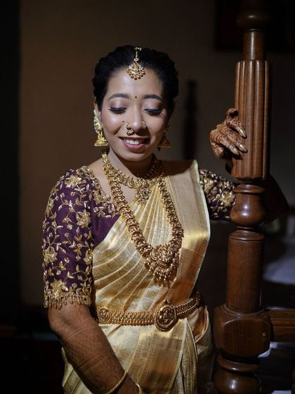 A close-up portrait showing the details of the bride's makeup. The eyes are subtly defined, and the skin has a healthy, radiant glow.