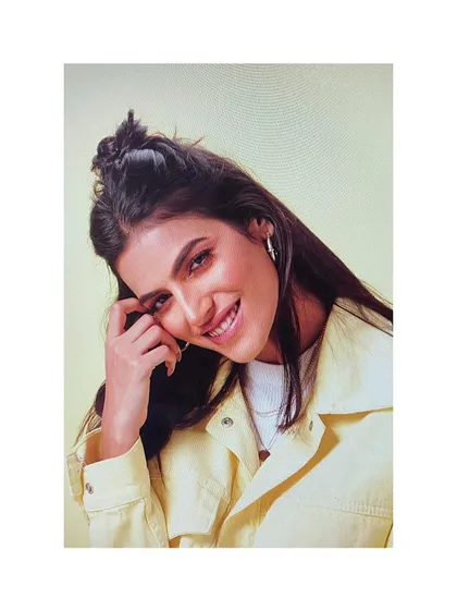 A fresh and youthful look for an Oriflame campaign. I used a pastel yellow jacket and a casual half-bun hairstyle to create a relatable, girl-next-door vibe.
