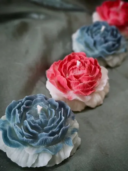 A line of my Scented Peony Candles in different colors. Let their gentle glow transport you to a world of timeless elegance and tranquility.